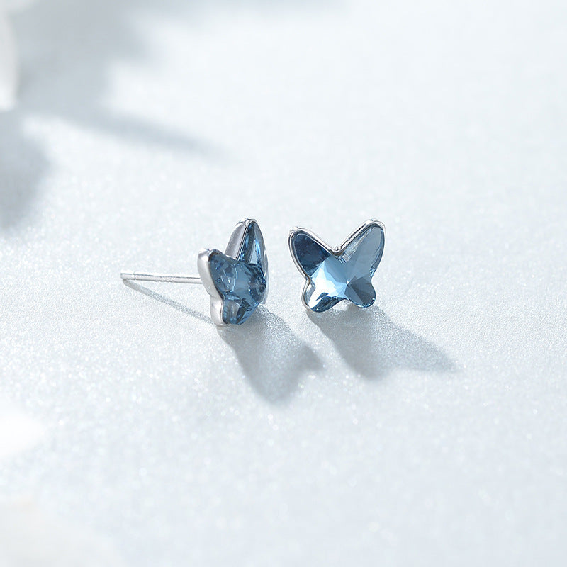 Collezione "Blue Whisper" con collana e orecchini con cristalli blu.